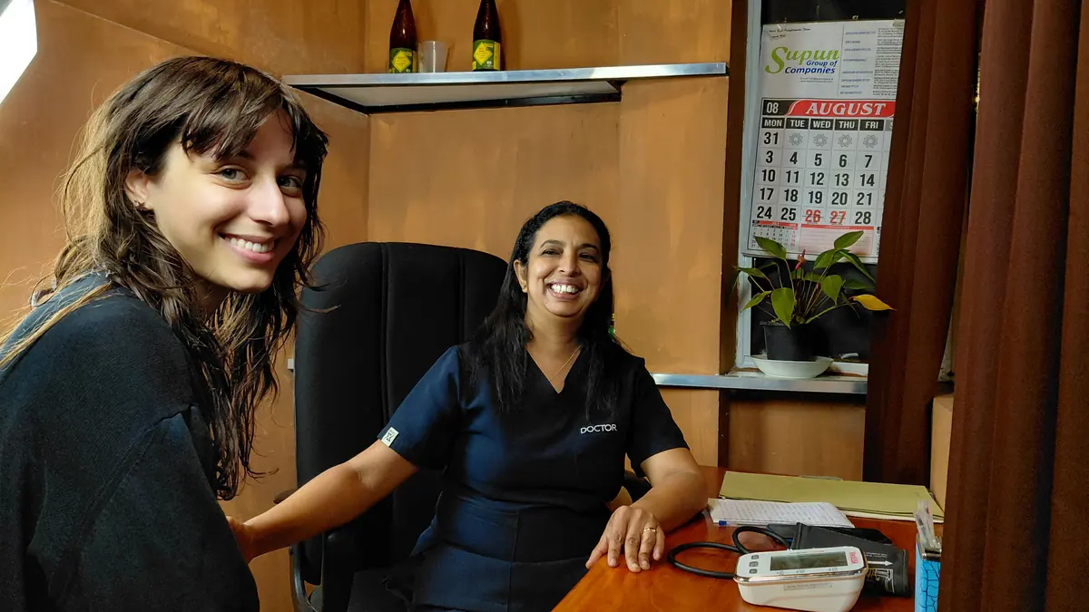 Dr. Walpolage Sandamali Samanthi seated with a visitor.