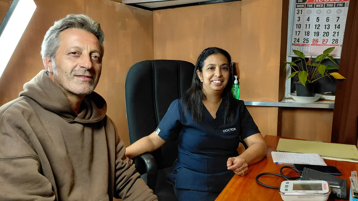Dr. Walpolage Sandamali Samanthi seated with another visitor.